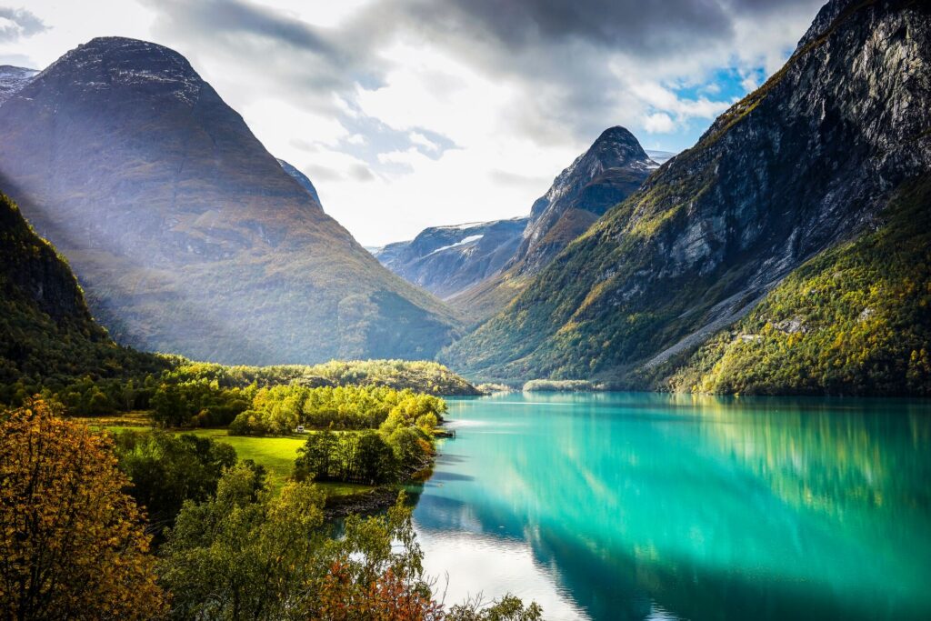 Clouds and sun beams over Geirangerfjord in Norway