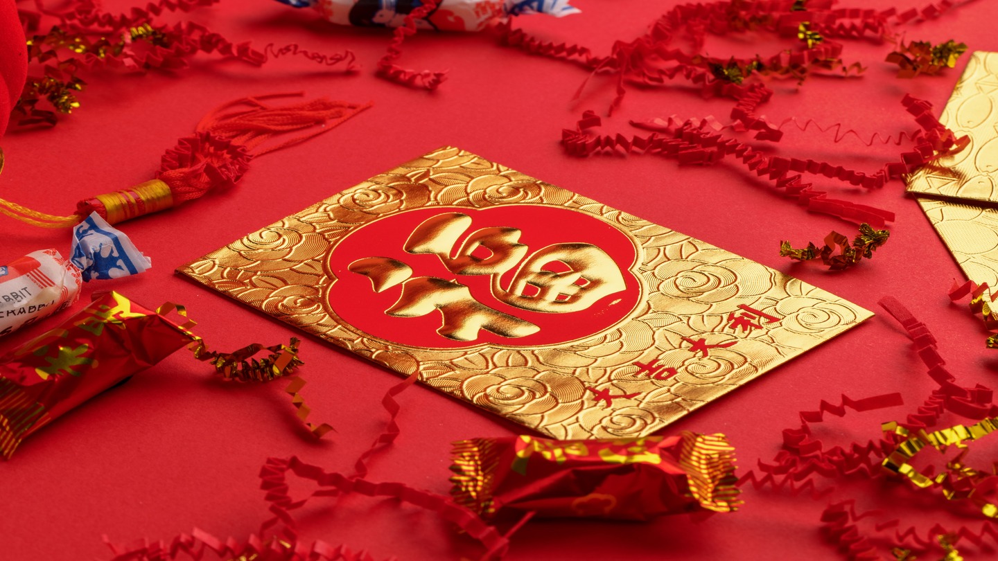  Chinese Red Envelopes surrounded by sweets