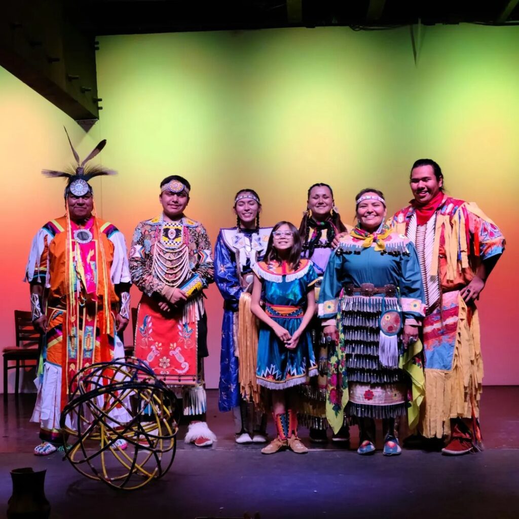 Colourful image of Red Heritage dancers, in traditional costume