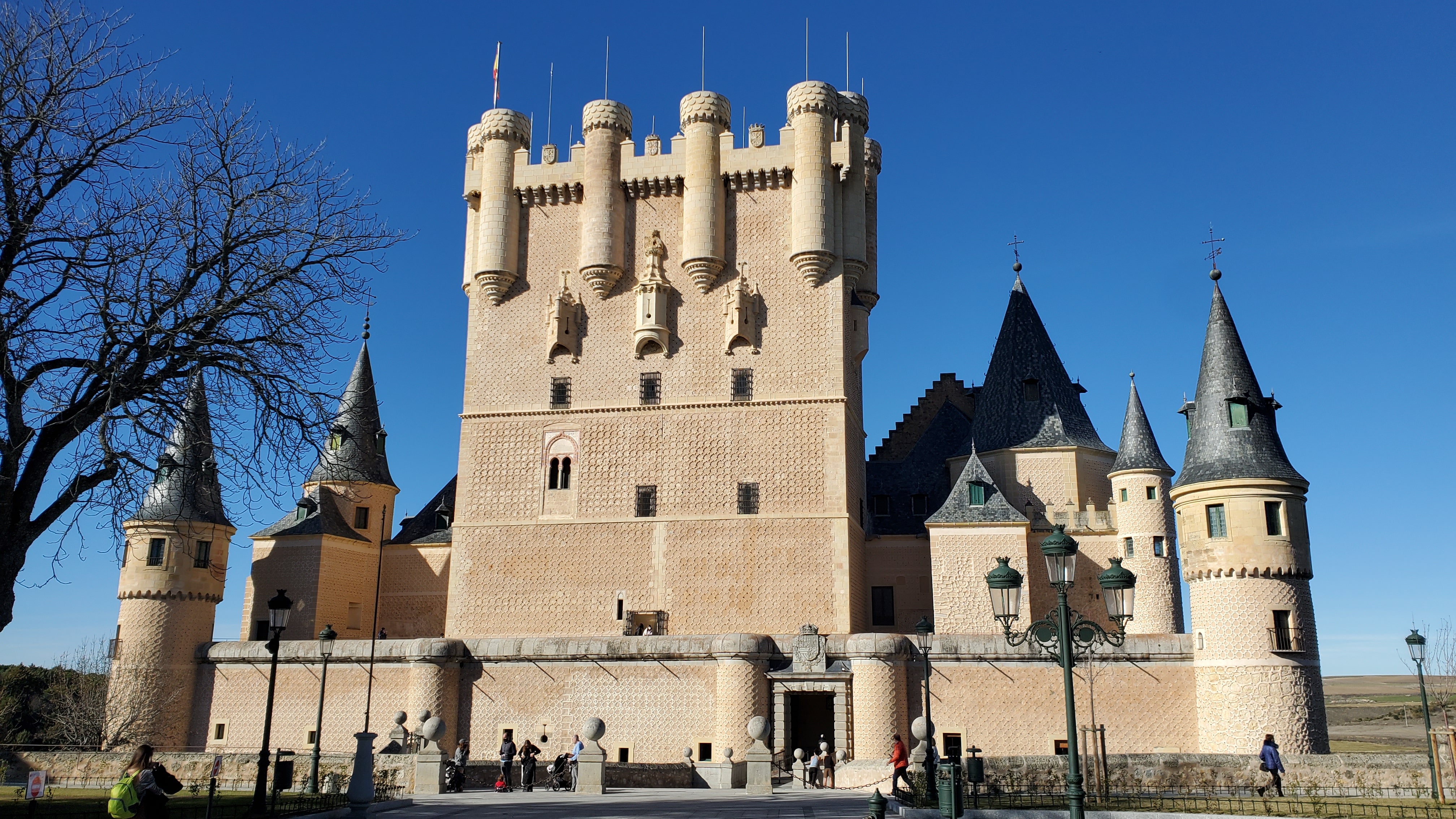 The white castle turrets of the Alcázar of Segovia, Spain.