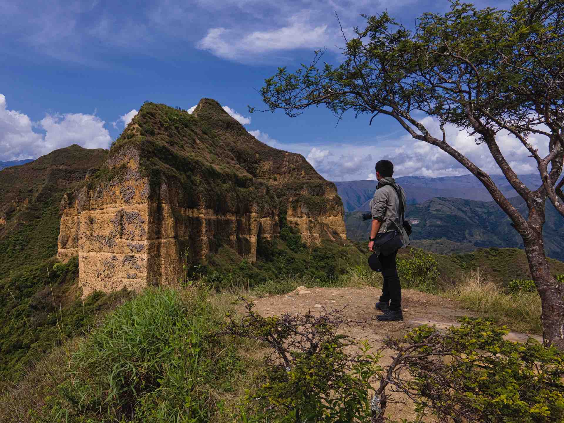 A man looks over the lost Inca city of Vilcabamba in Cuzco, Peru