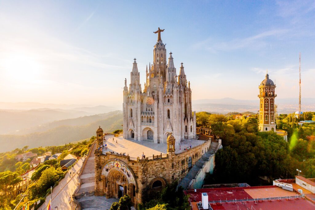 Barcelona cathedral stands proud against a bright blue sky.