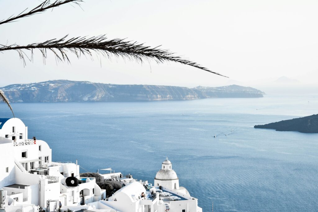 White building of a Greek town overlooking the sea