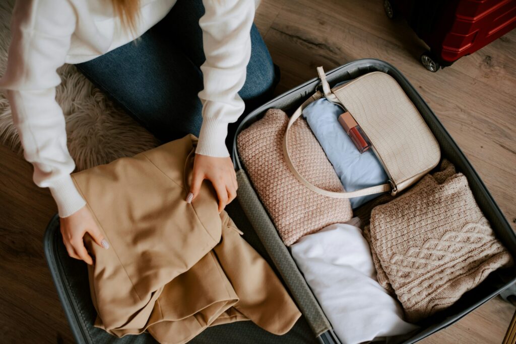 woman packing a suitcase