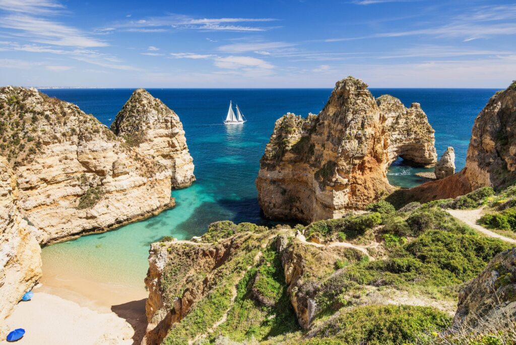 Golden sand beach with rocky outcrops in algarve, Portugal