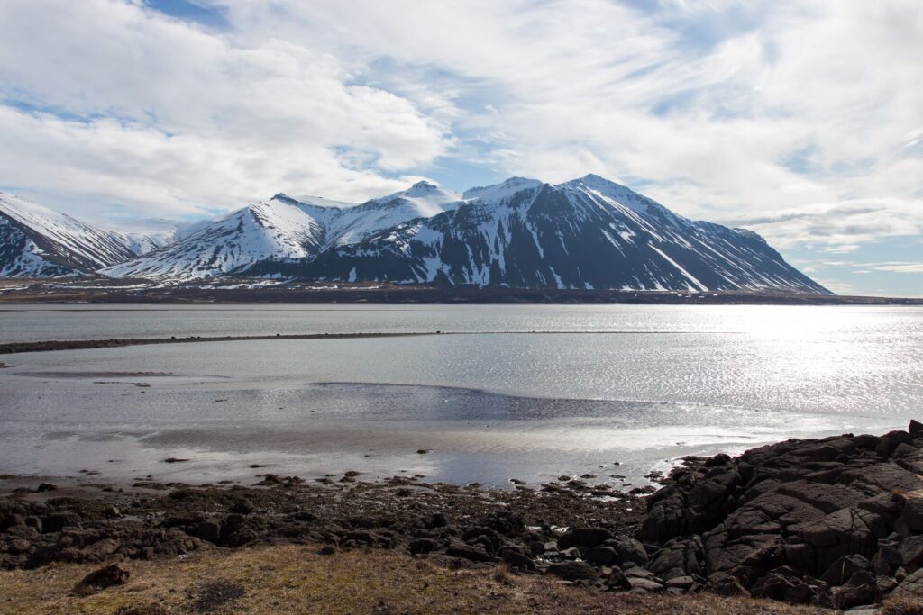 A snowy mountain with a large lake in front in Iceland