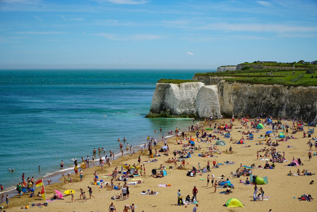 People enjoy a large sandy beach in Margate, UK