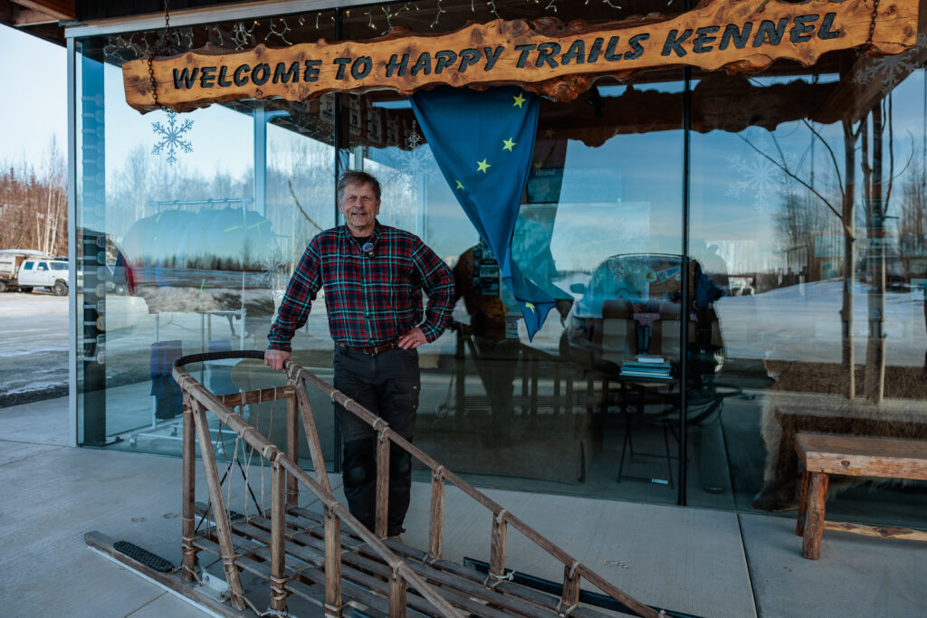 Martin Buser pictured in front of to his Happy Trails Kennel
