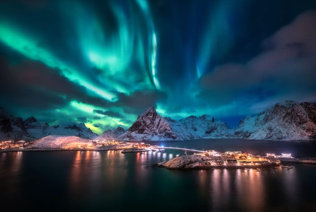 Green and blue Northern Lights dance in the night sky over Norway