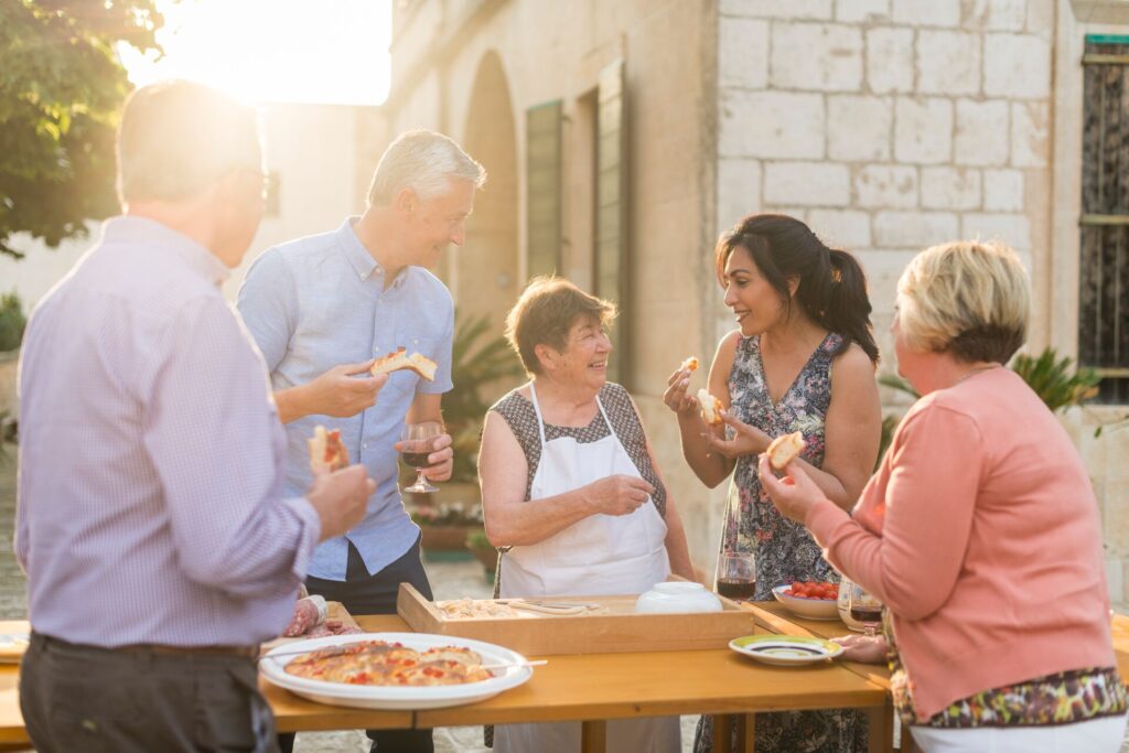 Guests learn to make pasta, outdoors in Italy