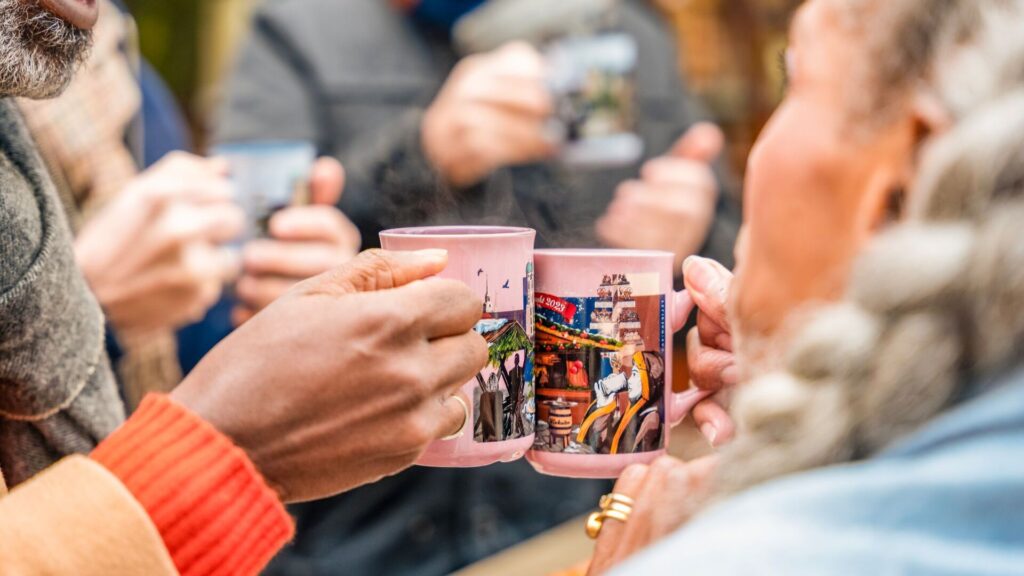 group cheersing at europe christmas market