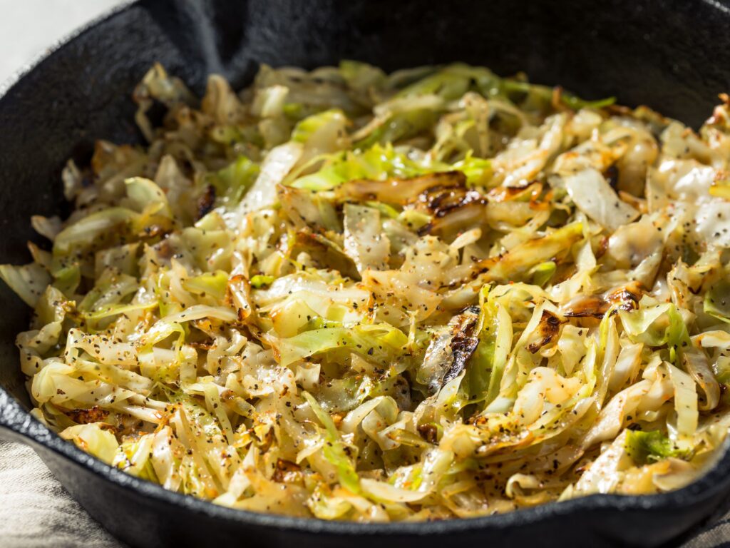 Cooked cabbage in a skillet pan