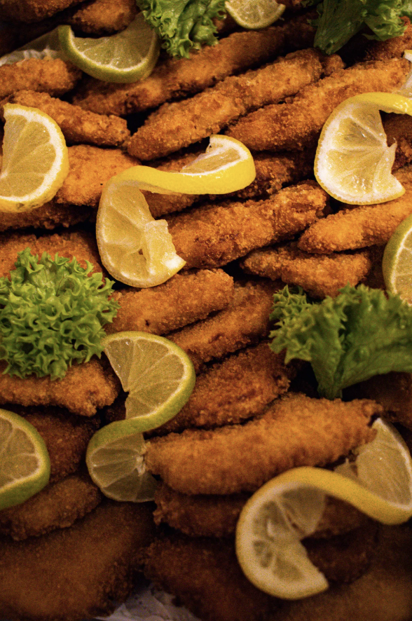 a close up shot of a brown bear’s face, with shaggy brown fur