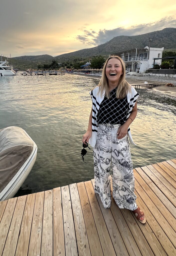 Gemma Myhill, TTC suatianble travel marketing expert smiles on the dock by the se in Turkey