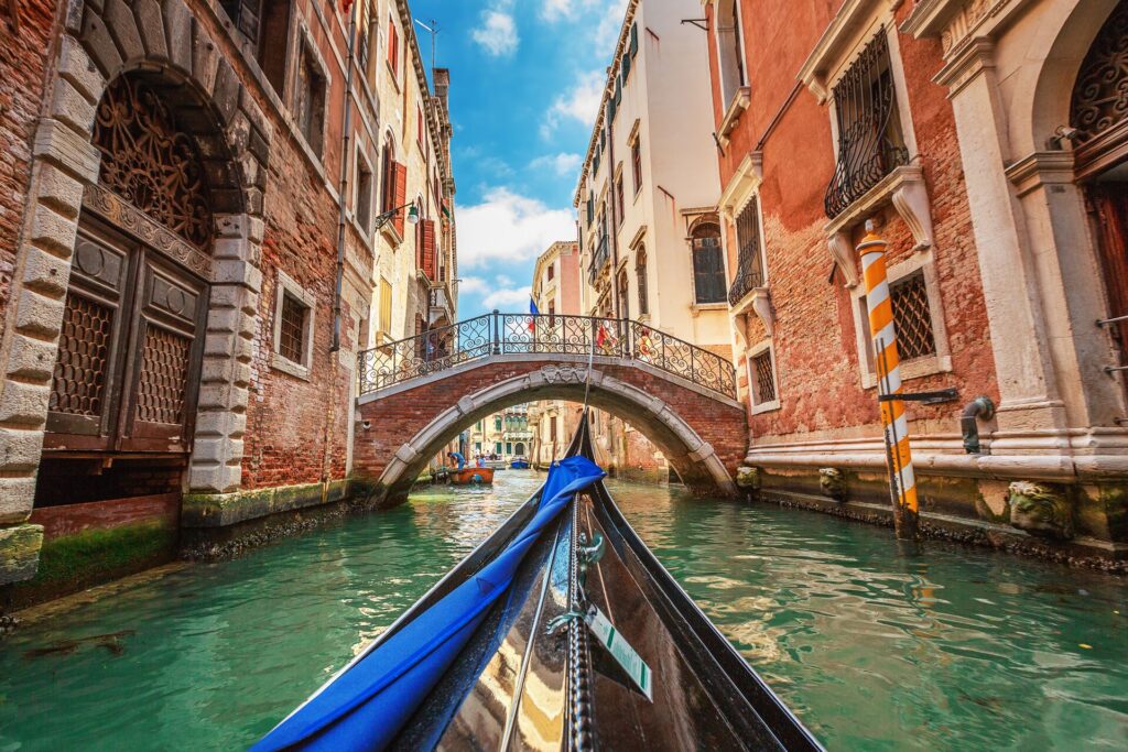 A gondola glides through the canals of Venice, Italy