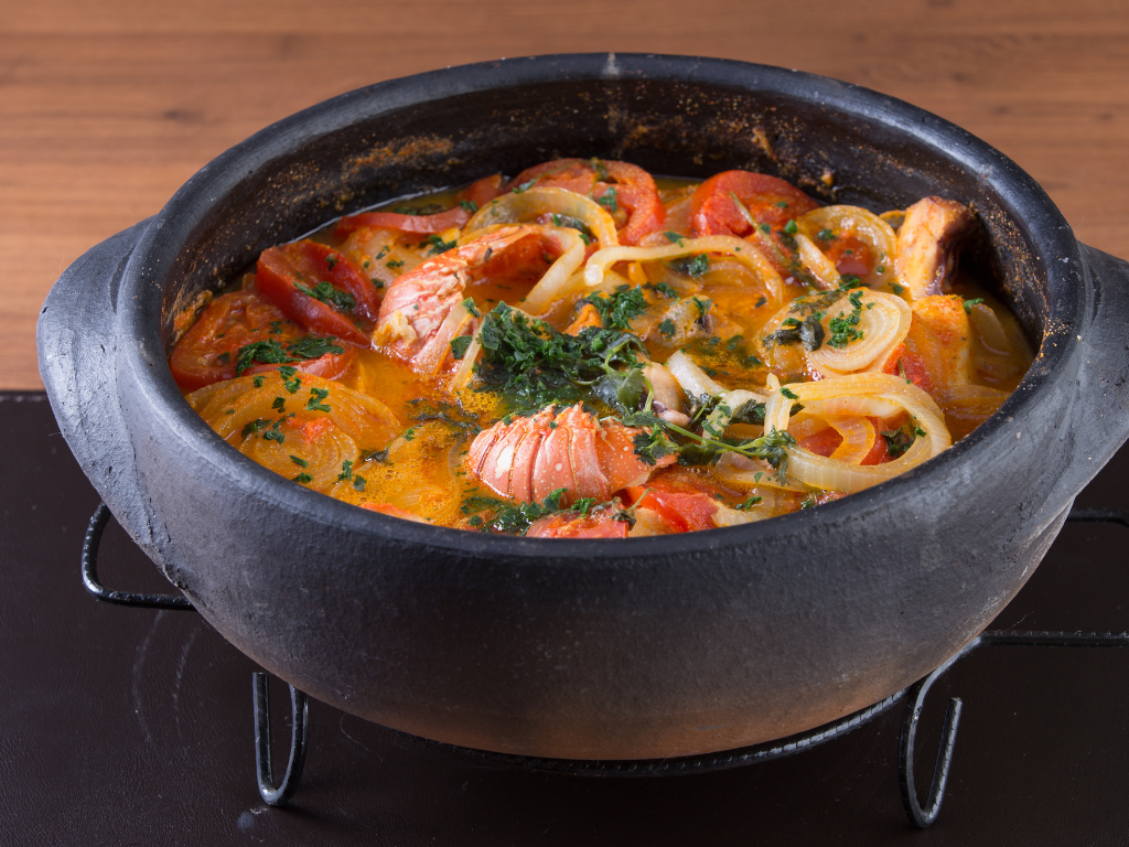 a close up shot of a brown bear’s face, with shaggy brown fur