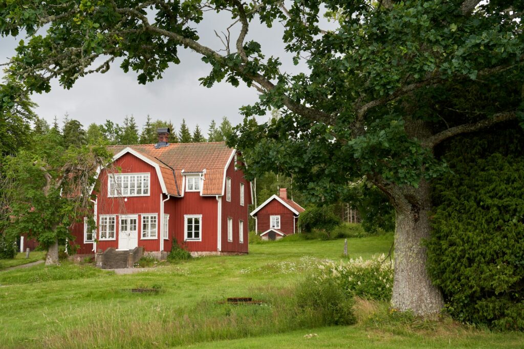 Traditional Falun red farmhouse and buildings in Sweden