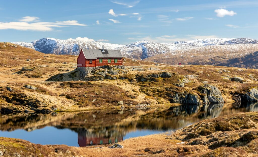 Red building in a rocky landscape