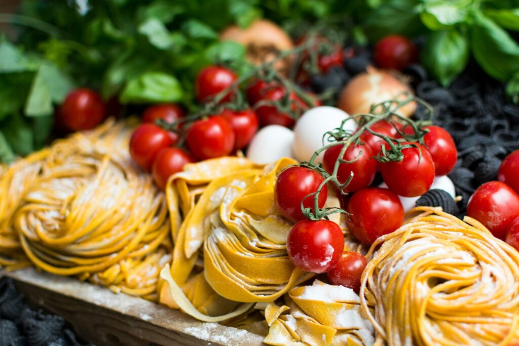 nests of pasta and fresh produce