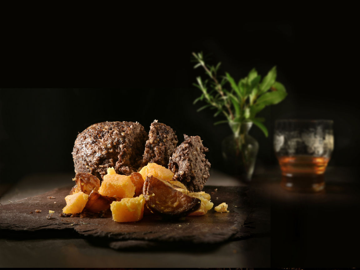 a close up shot of a brown bear’s face, with shaggy brown fur