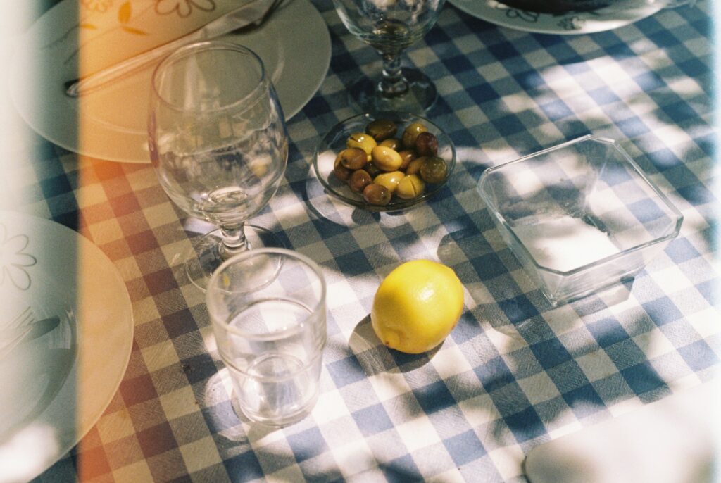 Wine glasses on a blue and white chequered table cloth