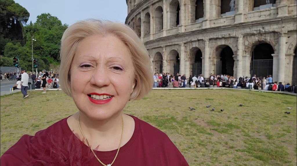 Travel Director Patrizia outside the Colosseum in Rome