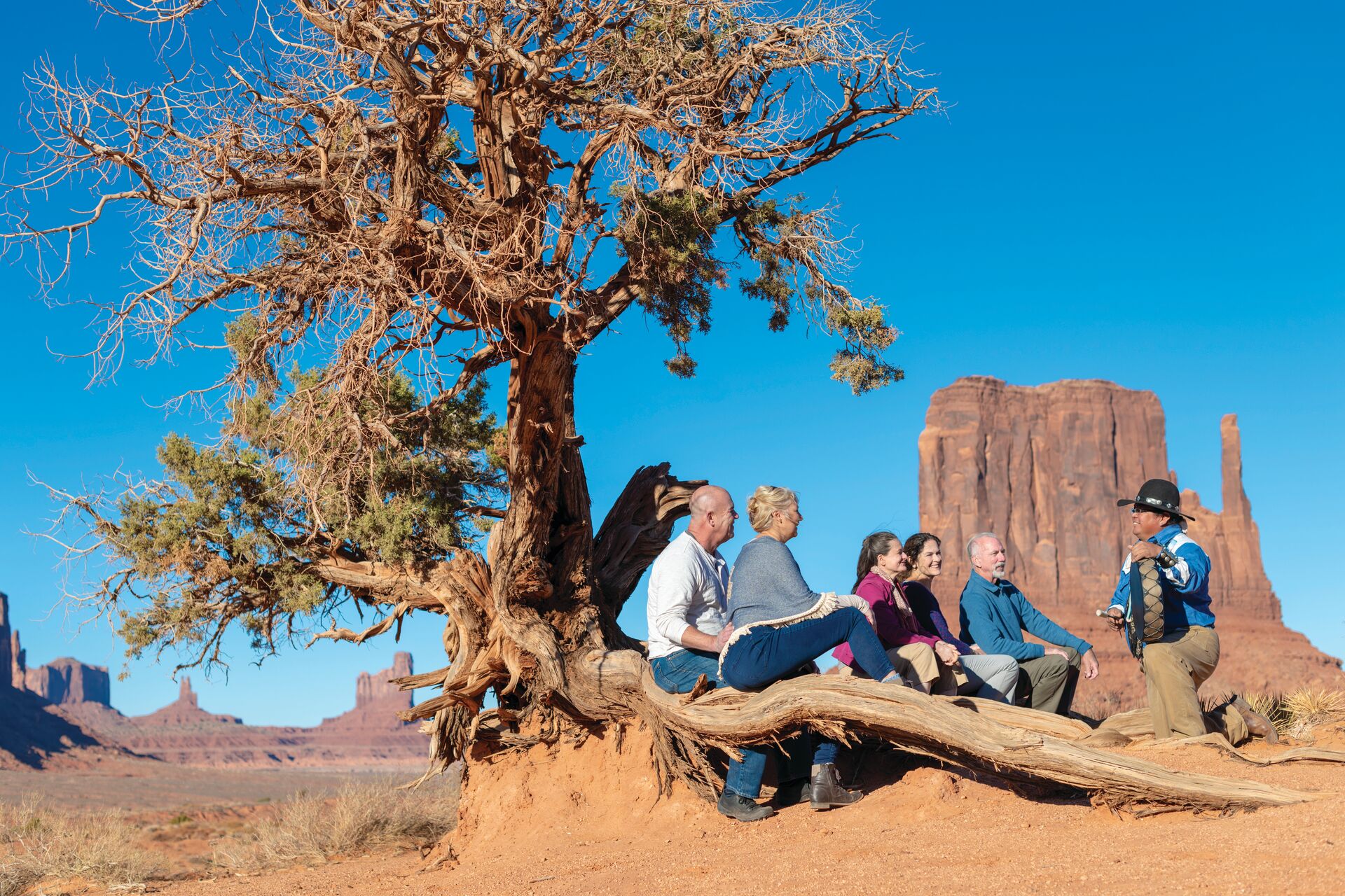 Navajo guide talking to some guests in Monument Valley, Utah