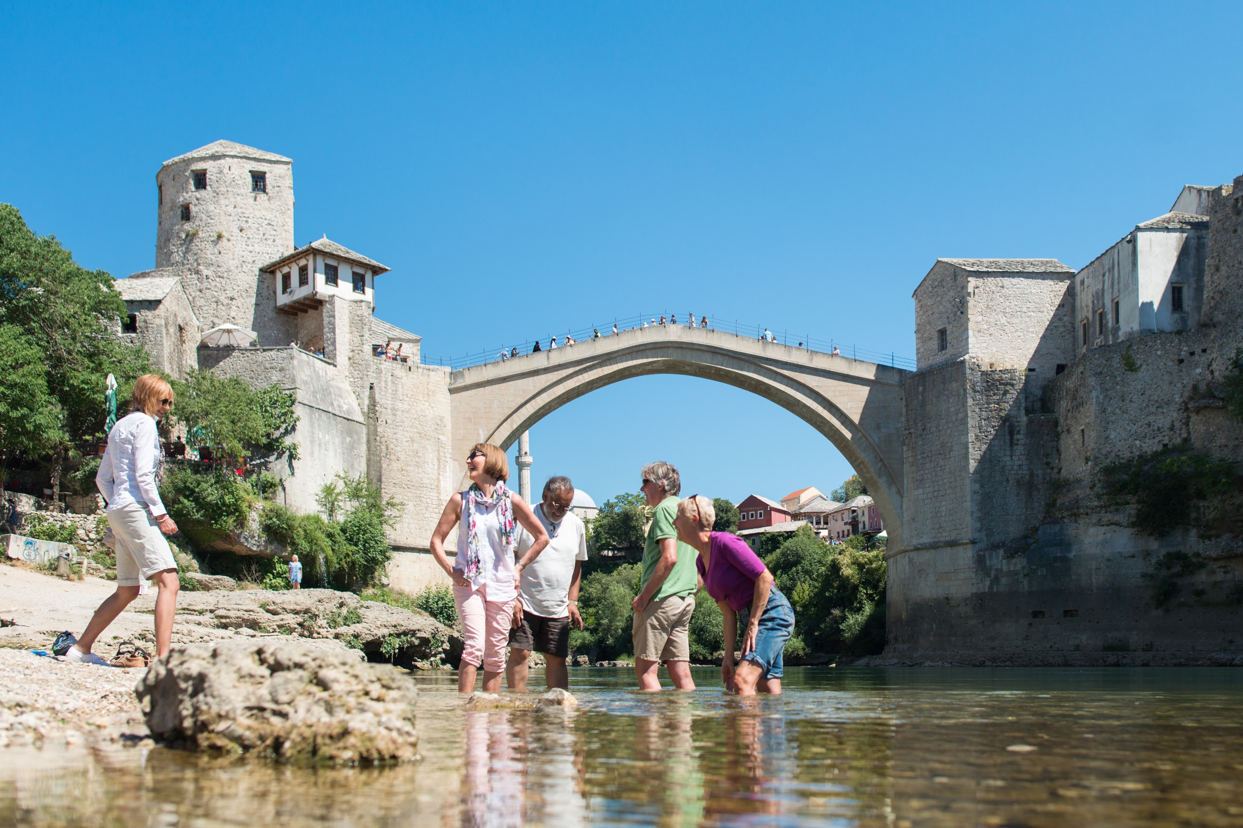 Guests enjoy a dip near the old bridge Mostar, Bosnia and Herzegovina
