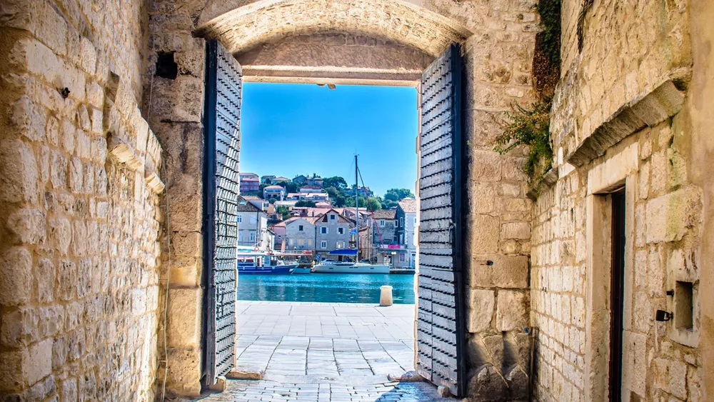 An open city gate overlooking the bay in Trogir, Croatia