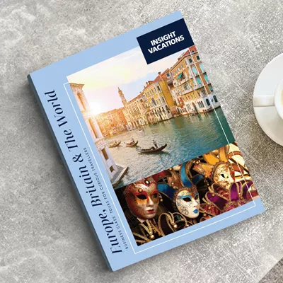 Insight Vacations brochure on table next to a cup of coffee