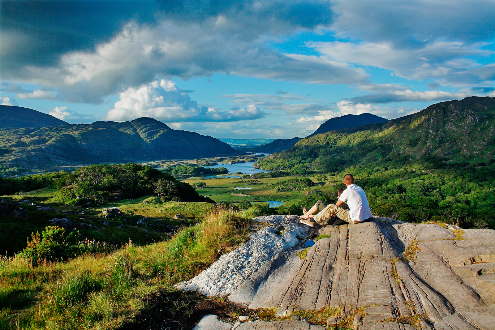 Climber admires the view at a peak in the ring of Kerry in Ireland