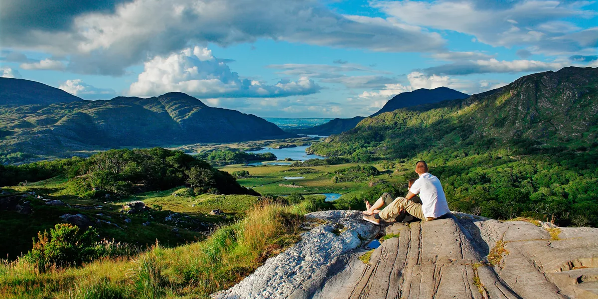 Climber admires the view at a peak in the ring of Kerry in Ireland