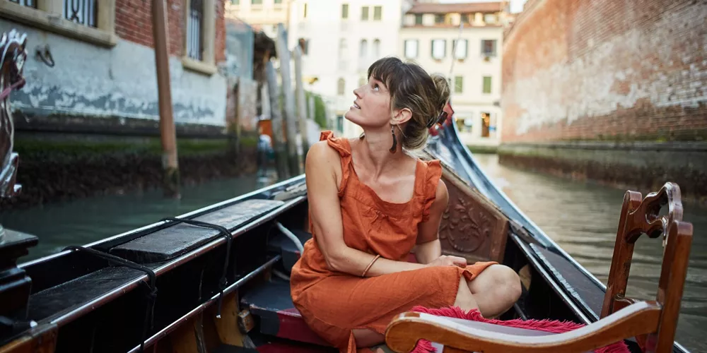 Woman In A Gondola in Venice, Italy