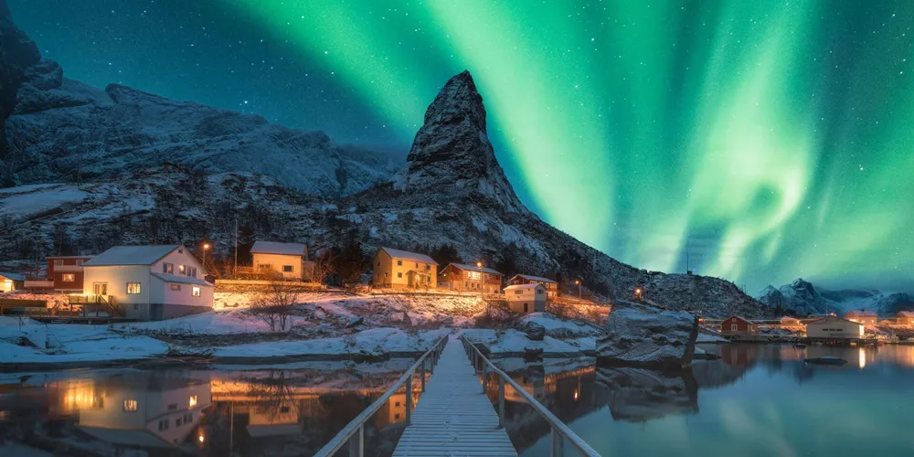 The Northern Lights over Reine in Lofoten Islands, Norway during winter