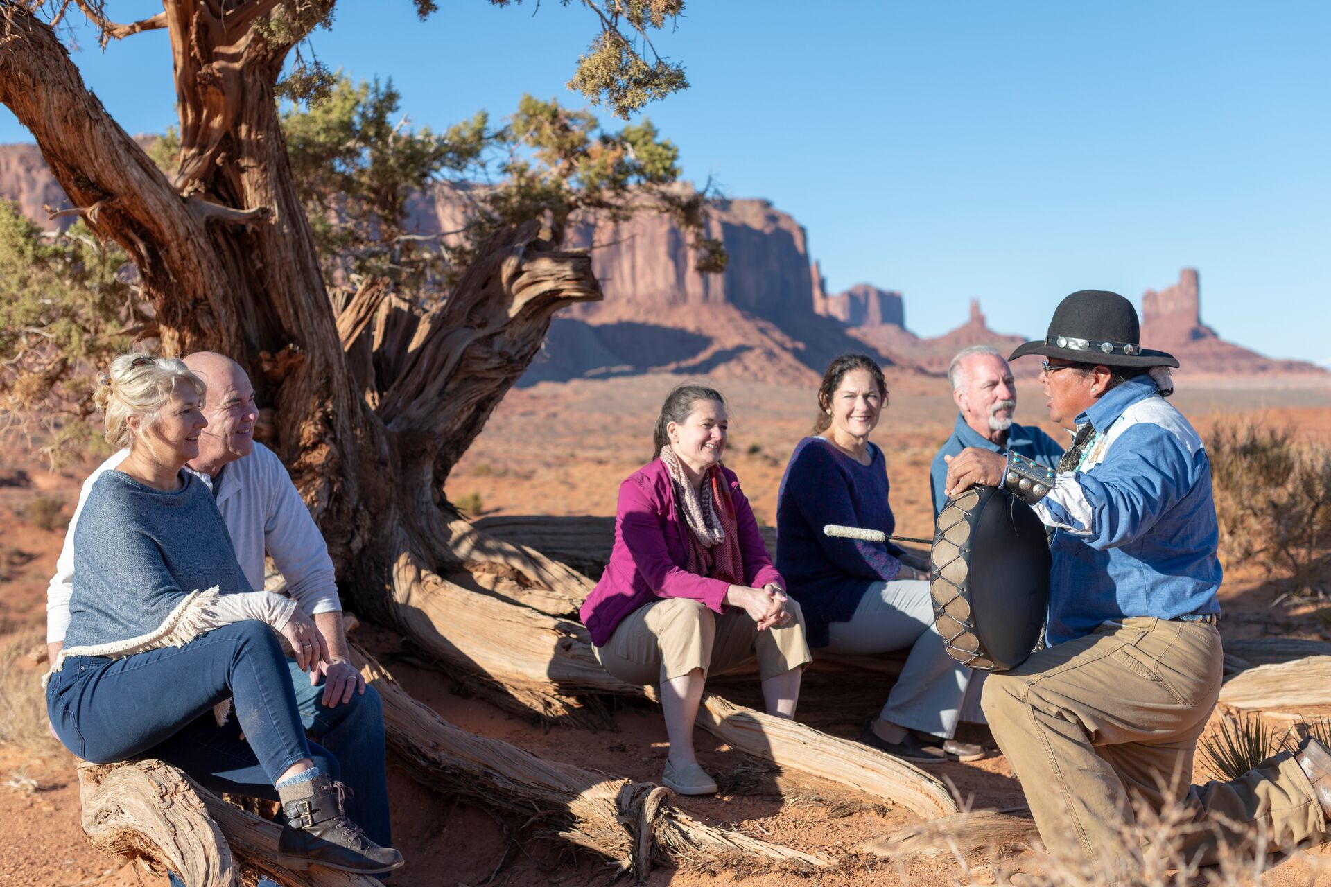 Navajo guide talking to a group of tourists in Monument Valley, USA