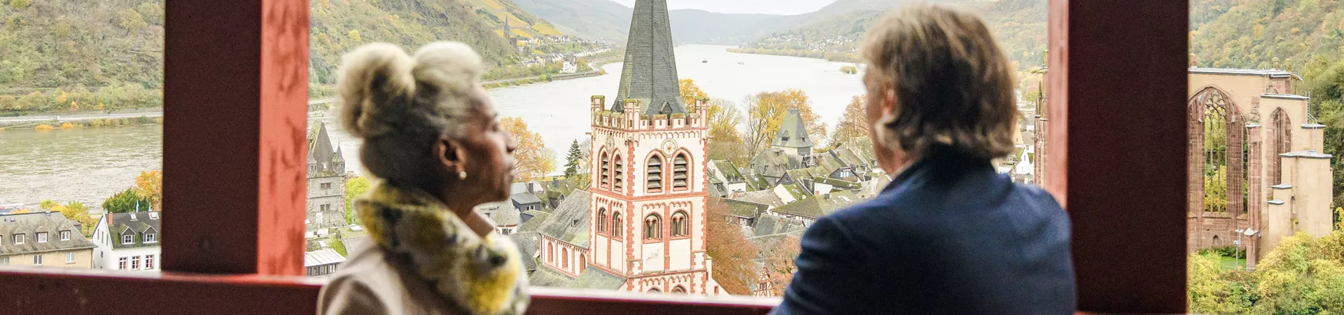 Two guests looking out at lake in Germany