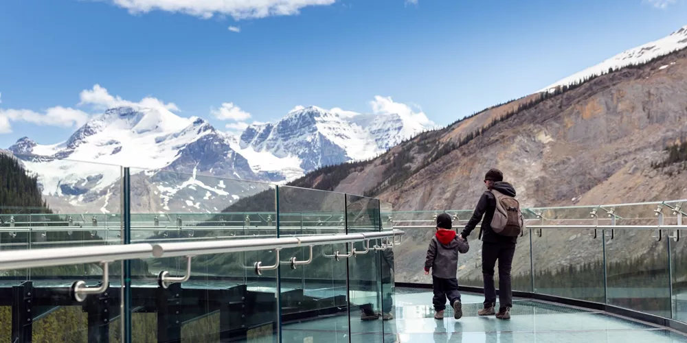 Large Mother And Son Waking On Columbia Icefield Skywalk During Summer In Jasper National Park 1294349547