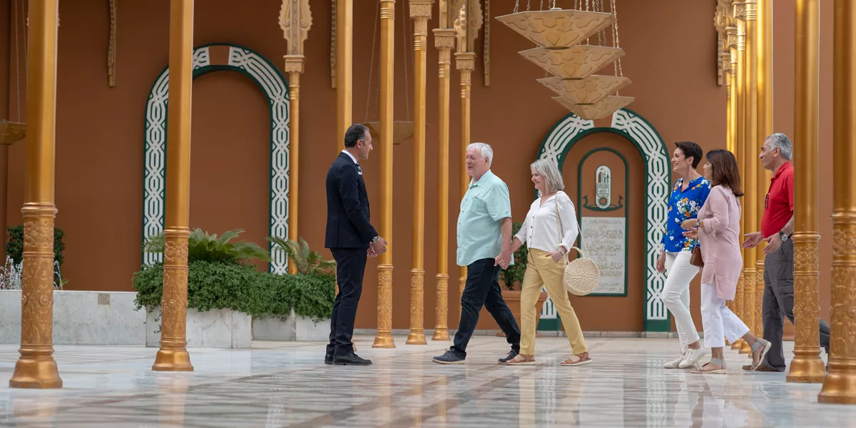 People sightseeing a palace