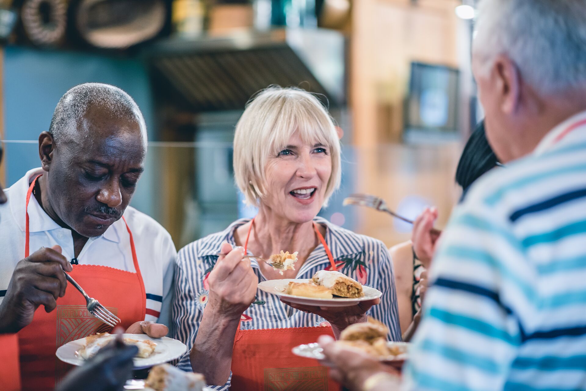 A couple tasting strudel in a Strudel House in Budapest, Hungary