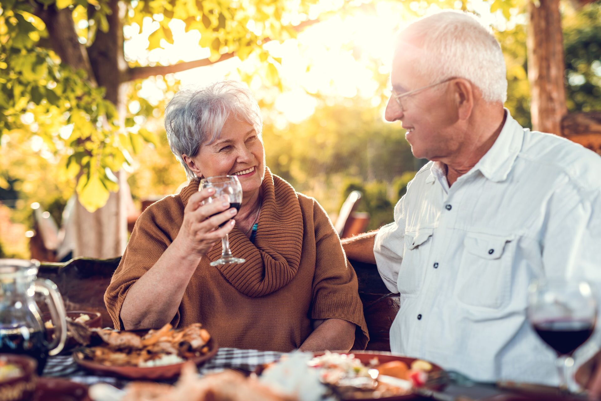 Senior couple drinking wine at dinner