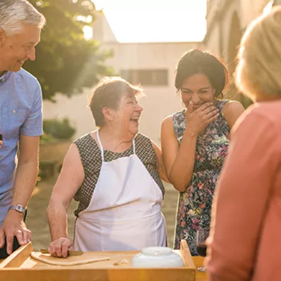 Tourists making pasta in Italy