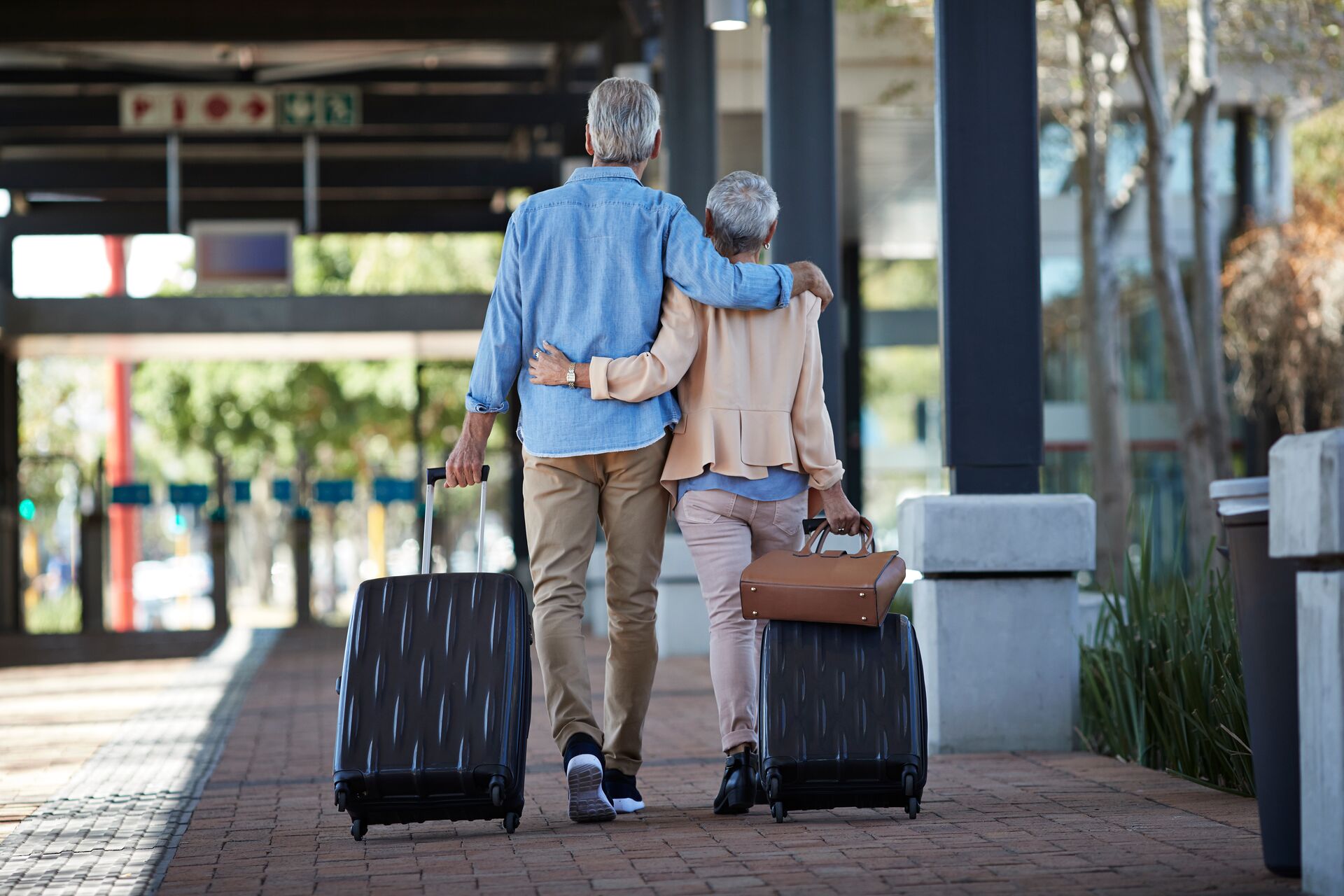 Large Senior Couple Walking Together On Public Transport Station 837180414 (2)
