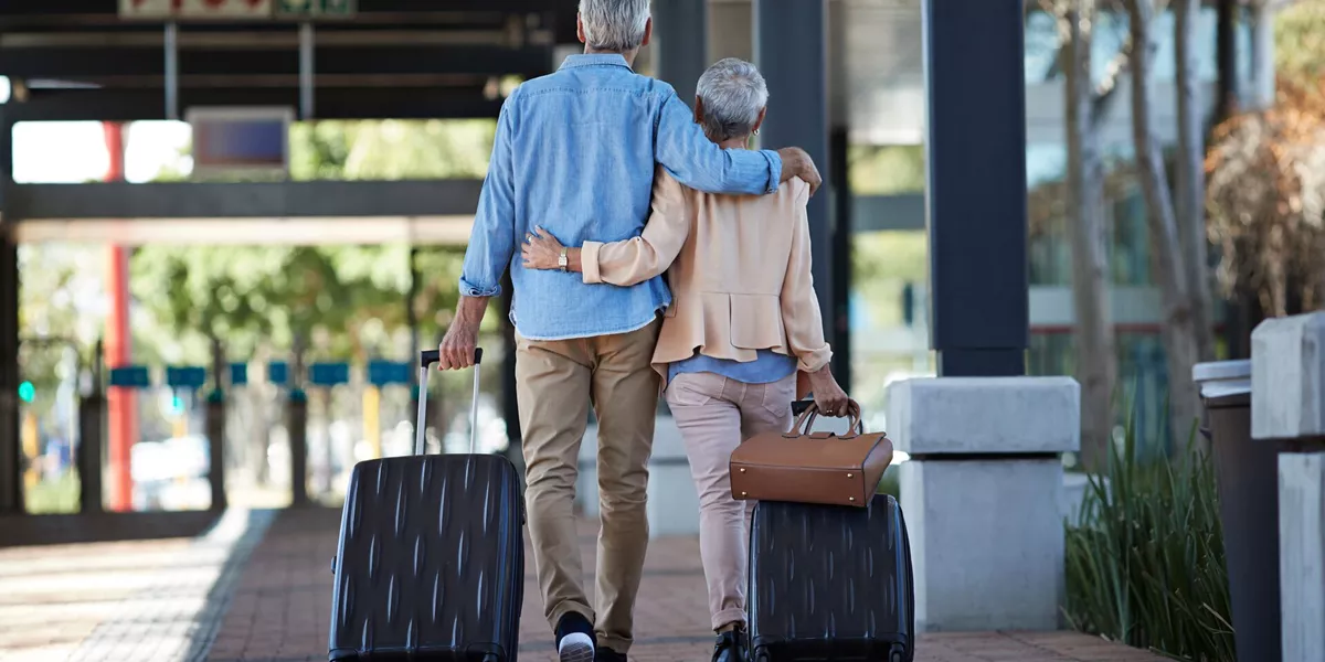Large Senior Couple Walking Together On Public Transport Station 837180414 (2)