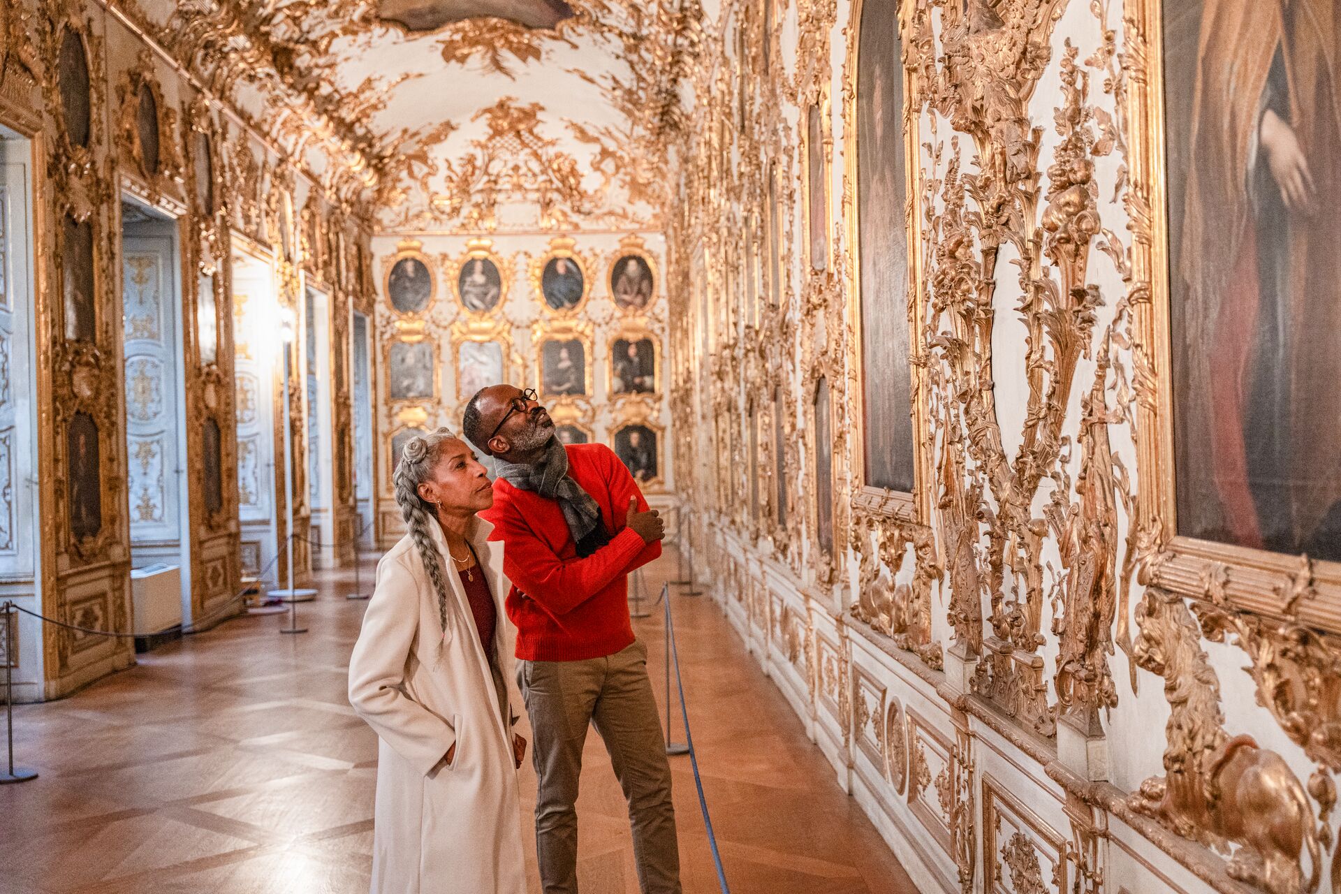 Two guests looking up at artworks in Munch Residence, Germany
