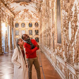 Two guests looking up at artworks in Munch Residence, Germany