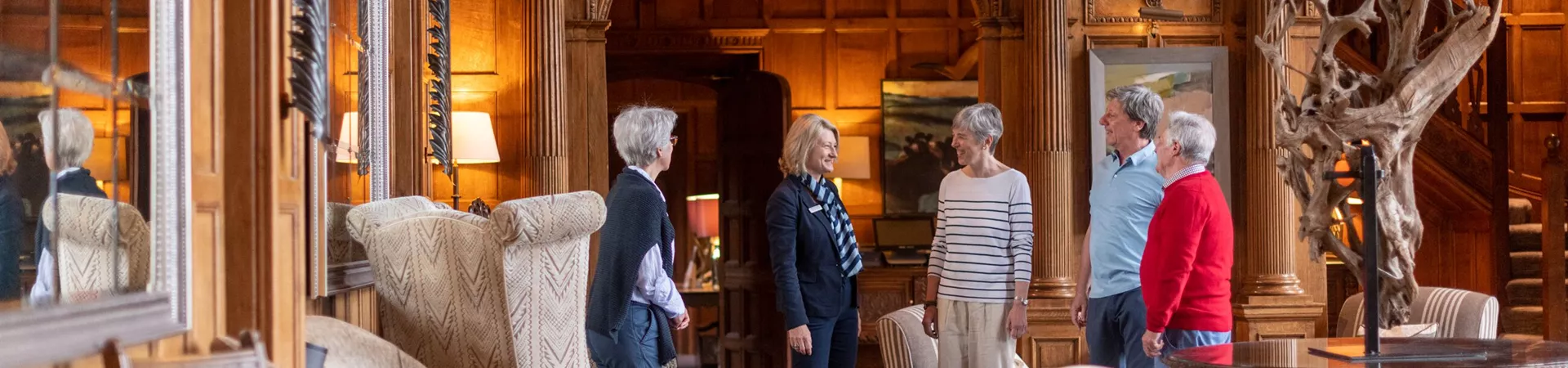 Travel Director welcoming guests at Bovey Castle in Devon, England