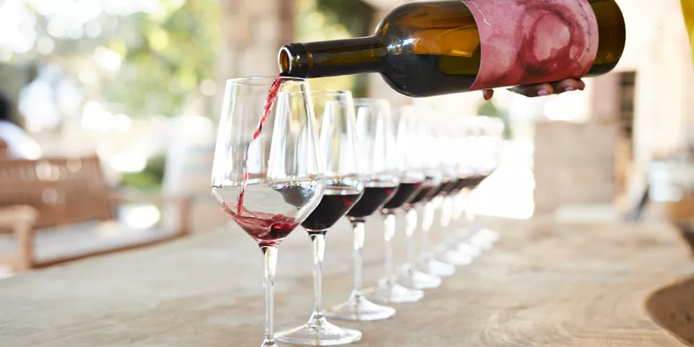 Wine being poured into glasses