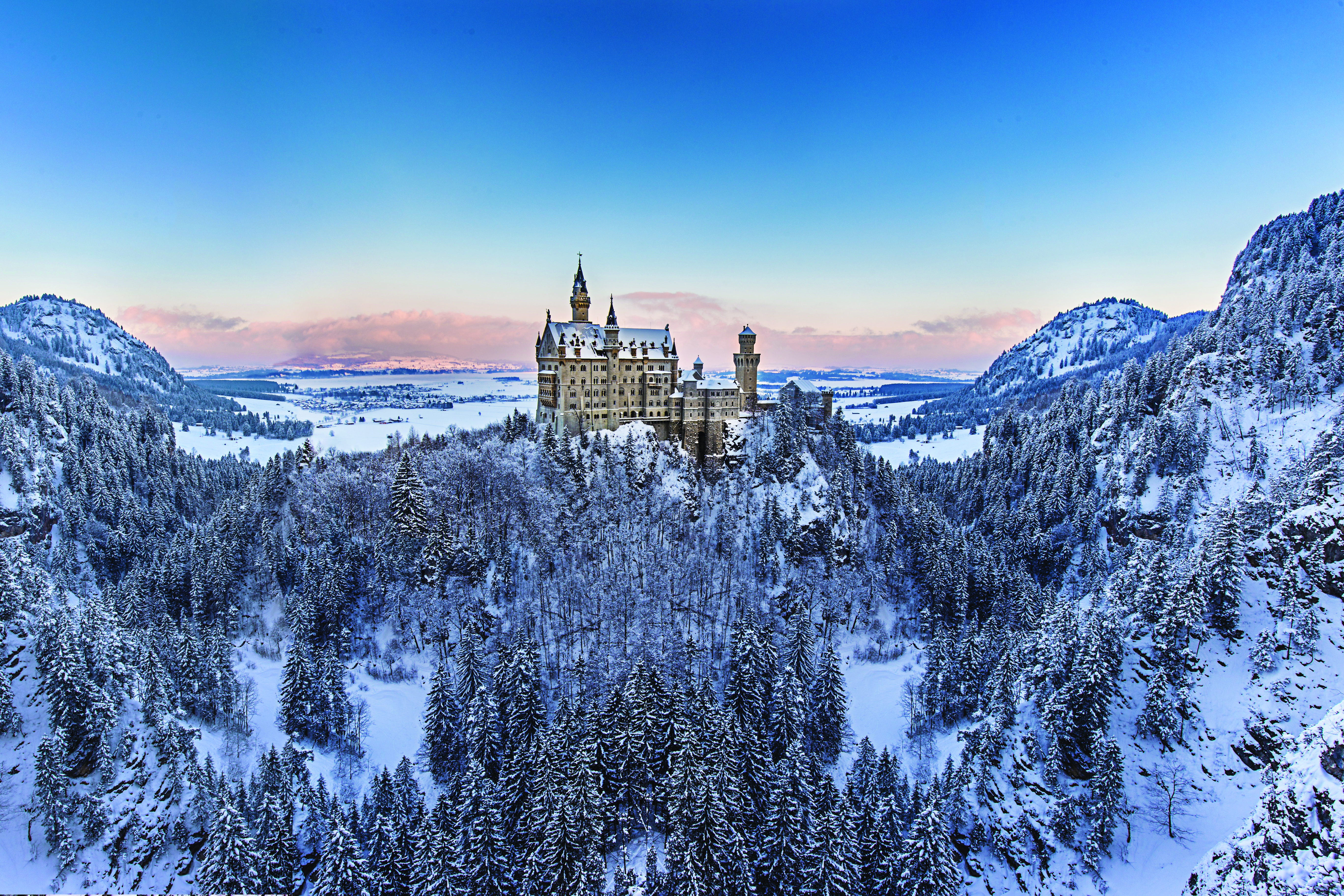 Neuschwanstein Castle in Germany surrounded by snow during winter