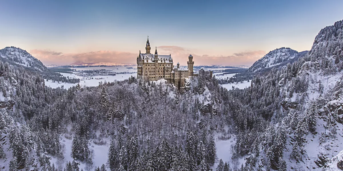 Neuschwanstein Castle in Germany surrounded by snow during winter