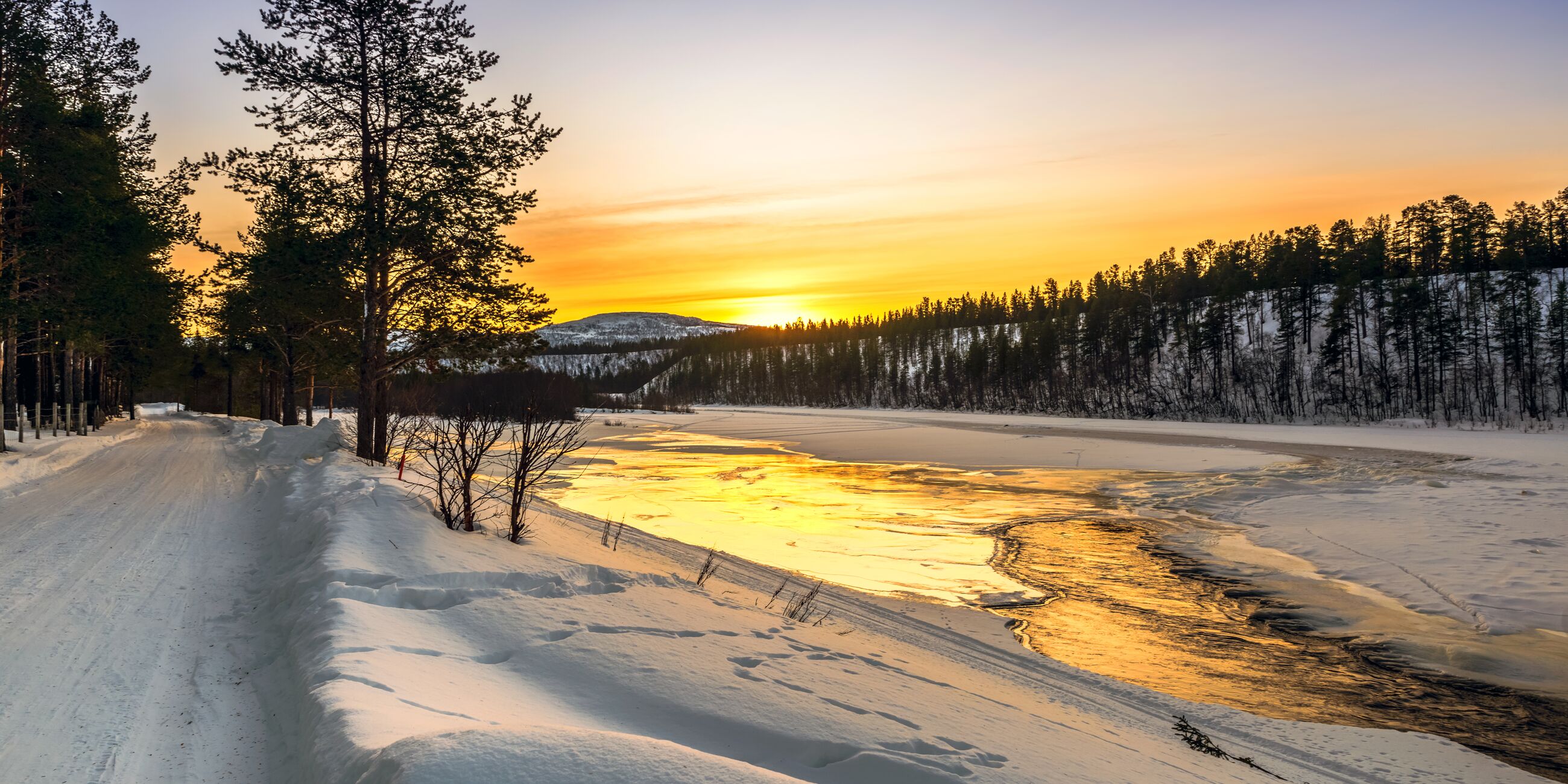 Sunrise on a lake in the arctic in Norway at winter